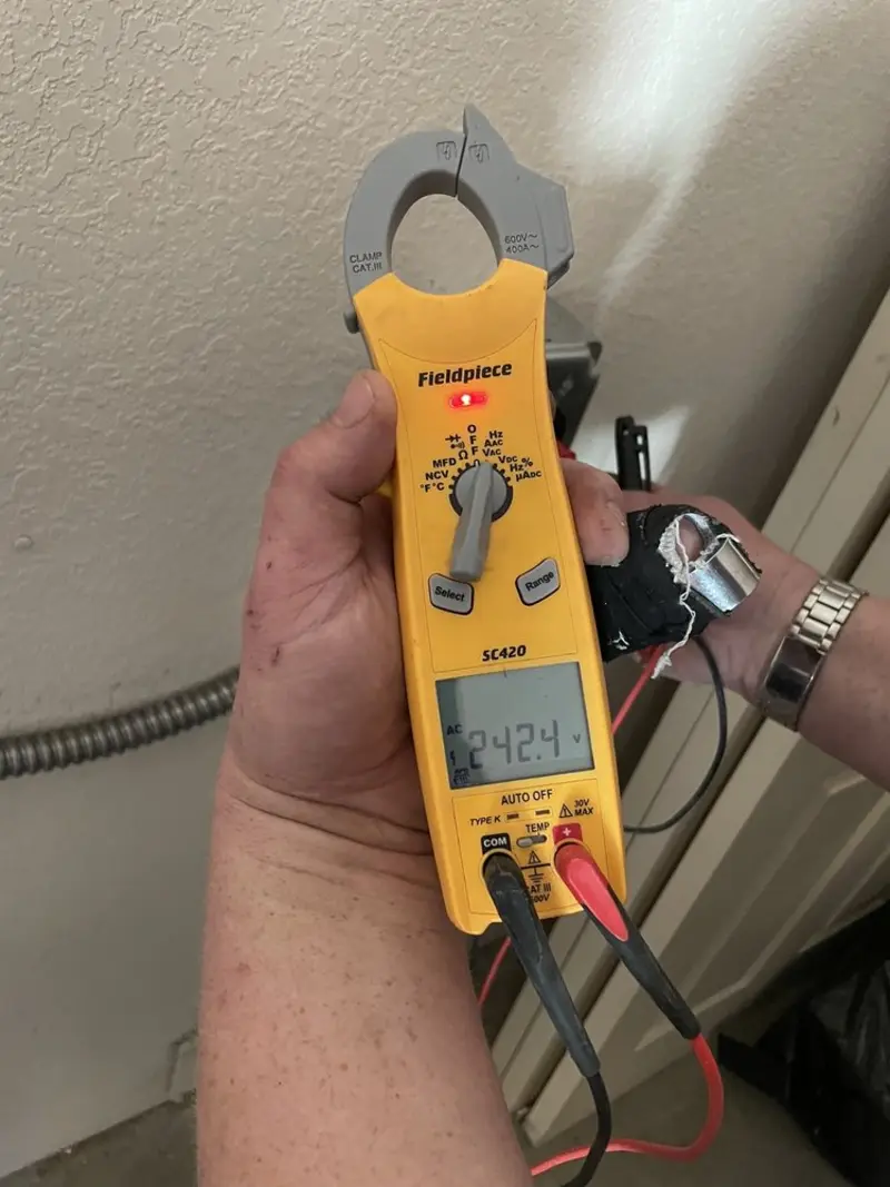Voltage testing with clamp meter during Outlet Installation in East Rancho Dominguez